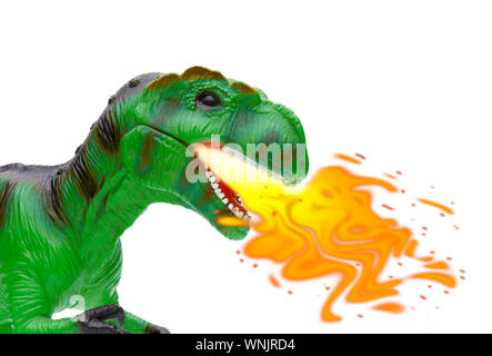 Close up view of a toy dragon breathing fire, isolated and shot on a white background Stock Photo