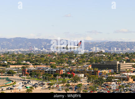Los Angeles, California, USA - May 22, 2019: A plane from Delta Airlines lands on the Los Angeles International Airport (LAX). Stock Photo