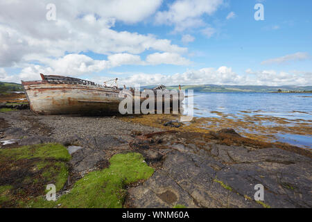 Two old wooden fishing boats wait for the fishermen at the harbour