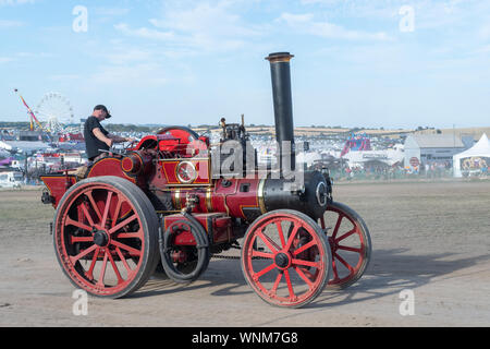 Blandford Forum.Dorset.United Kingdom.August 24th 2019.A vintage traction engine is being driven at The Great Dorset Steam Fair. Stock Photo