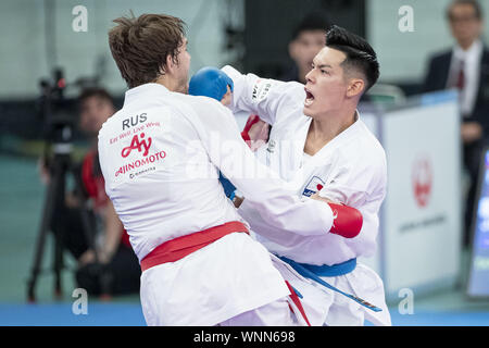 Tokyo, Japan. 6th Sep, 2019. Aleksandr Shcherban of Russia (red) fights against Ken Nishimura of Japan (blue) during the elimination round of Male Kumite's -75kg category at Karate1 Premier League Tokyo 2019. The Karate1 Premier League is held from September 6 to 8 at the Nippon Budokan. The KarateÂ will make its debut appearanceÂ at the Tokyo 2020 Summer Olympic Games. Ken Nishimura won the bout. Credit: Rodrigo Reyes Marin/ZUMA Wire/Alamy Live News Stock Photo