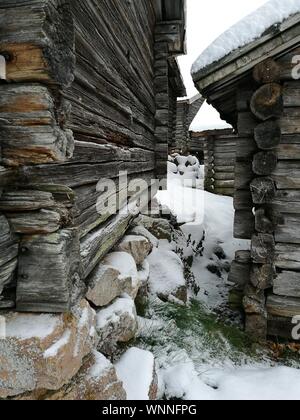 Winter Log Cabins In The Snow In Norway Surrounded By A Frosty