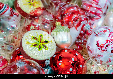 Christmas decorations on the Christmas tree of various shapes and sizes. Stock Photo