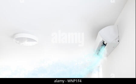 Air conditioner in white room blowing cold air Stock Photo