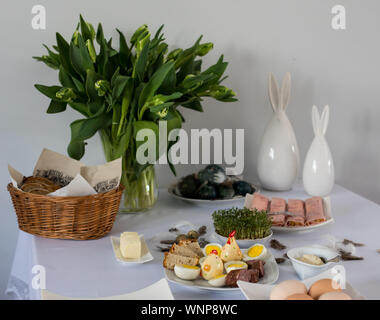Traditional, polish Easter table with colored eggs, boiled eggs Stock Photo