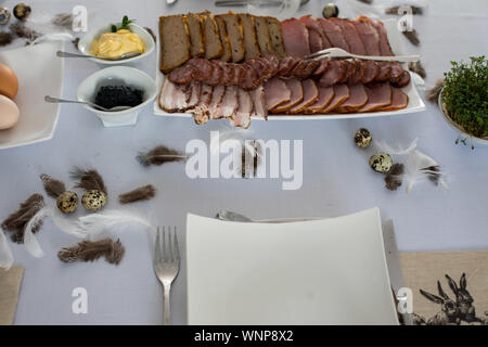 Traditional, polish Easter table with colored eggs, boiled eggs Stock Photo