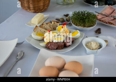 Traditional, polish Easter table with colored eggs, boiled eggs Stock Photo