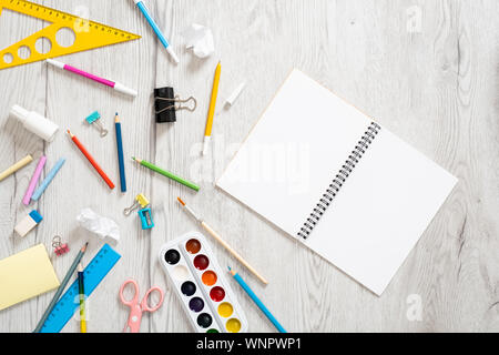 School stationery on wooden background. Flat lay, top view. Back to school concept. Stock Photo