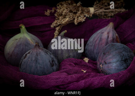 Fresh figs on the violet background Stock Photo