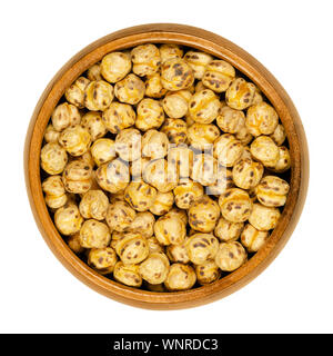 Roasted yellow chickpeas in wooden bowl. Crispy snack, vegan, high protein source, made of cooked chick peas. Isolated macro food photo, closeup. Stock Photo