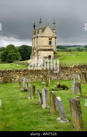 East Banqueting House and cemetery of St James' church under cloudy sky in Chipping Campden England Stock Photo