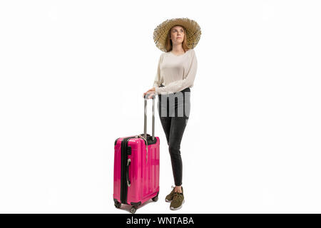 woman with suitcase and summer hat against a white background Stock Photo