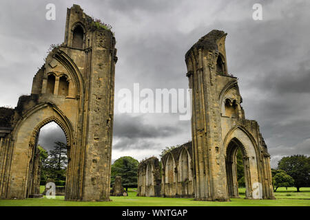 Rain clouds over Glastonbury Abbey monastery Great Church ruins from the 12th Century in Glastonbury Somerset England Stock Photo