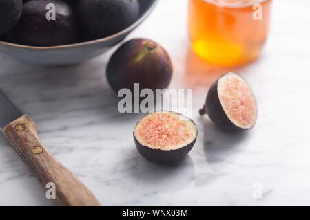 Fresh figs in a bowl on a stone gray background Stock Photo