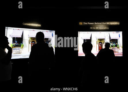 Berlin, Germany. 6th Sep, 2019. Visitors compare the image quality of an 8K television with a 4K television at the booth of Sony during the 2019 IFA fair in Berlin, capital of Germany, on Sept. 6, 2019. The 59th Consumer Electronics Unlimited (IFA) fair, Europe's biggest consumer electronics show, opened in Berlin on Friday, with the latest products and innovations from the leading global brands. Credit: Shan Yuqi/Xinhua/Alamy Live News Stock Photo