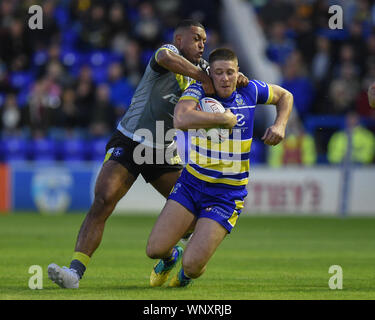 6th September 2019 , Halliwell Jones Stadium, Warrington, England;  Betfred Super League Rugby, Round 28, Warrington Wolves vs Wakefield Trinity ; Tom Lineham (2) of Warrington Wolves is tackled by Reece Lyne (4) of Wakefield Trinity Credit: Richard Long/News Images Stock Photo