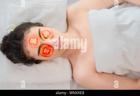 Beauty young asian woman relax and lying on massage bed in spa salon.Traditional thai oriental aromatherapy and Massage beauty treatments with fresh s Stock Photo