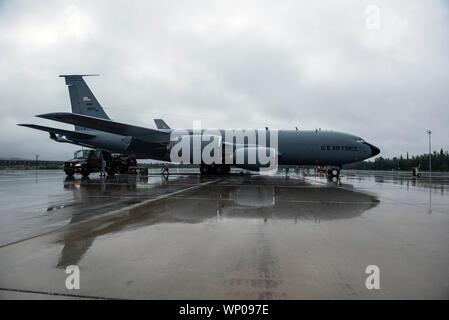 U.S. Airmen from MacDill Air Force Base, Fla., Kadena Air Base, Japan, and Eielson Air Force Base, Ala., prepare and refuel a 909th Air Refueling Squadron KC-135 Stratotanker, Kadena Air Base, Japan, before a mission during RED FLAG-Alaska 19-3 at Eielson Air Force Base, Alaska, Aug. 16, 2019. RF-A is conducted on the Joint Pacific Alaska Range Complex with air operations flown primarily out of Eielson Air Force Base and Joint Base Elmendorf-Richardson, Alaska. The JPARC is the largest instrumental air, ground and electronic combat training range in the world. (U.S. Air Force photo by Tech. Sg Stock Photo