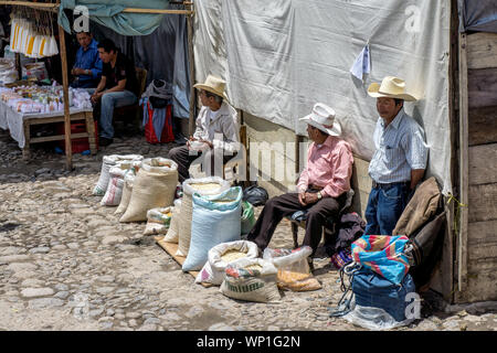 Chichicastenango, Guatemala - Mayan farmers sell grain at the street market in town Stock Photo