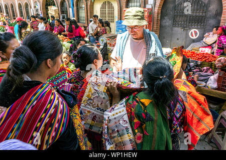 Mayan Women Sell Textiles to Tourists at the Street Market in Chichicastenango, Guatemala