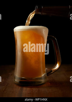 Cold Glass of Beer Poured Stock Photo