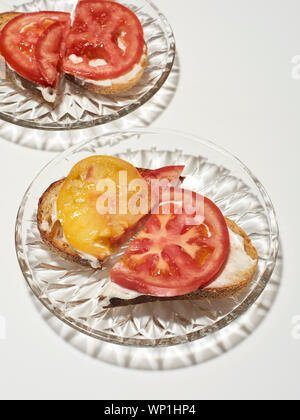 Tomato toast on glass plates Stock Photo