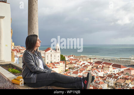 Portugal, Lisboa, Alfama, Largo das Portas do Sol, Woman enjoying viewpoint Stock Photo