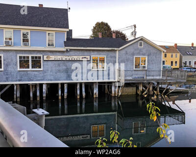 Portsmouth, NH / USA - Oct 16, 2018: Sanders Fish Market on a fall evening. The market sits on the Piscataqua River, a short walk from Market Square. Stock Photo
