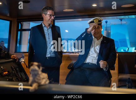 06 September 2019, Bavaria, Weßling: Markus Söder (CSU;m), Prime Minister of Bavaria, is standing on the bridge of the Seeshaupt next to Markus Blume, Secretary General of the CSU, during the shipping on Lake Starnberg within the framework of the CSU board meeting. Photo: Lino Mirgeler/dpa Stock Photo