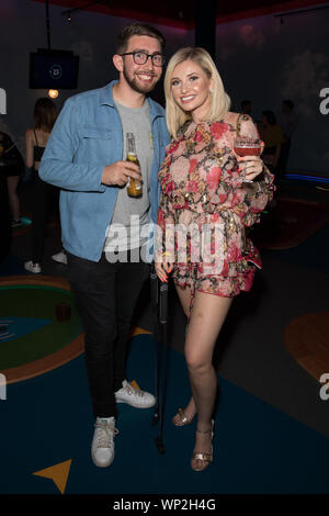 Amy Hart and her brother Sam attend the launch of Puttshack Lakeside in