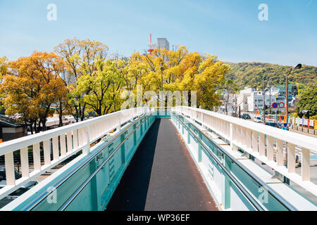 Pedestrian overpass and city in Tokushima, Shikoku, Japan Stock Photo