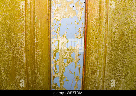 The texture of the wooden surface painted in green and blue. The paint is old, cracked. Place for text. Background. Stock Photo