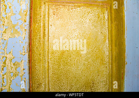The texture of the wooden surface painted in green and blue. The paint is old, cracked. Place for text. Background. Stock Photo