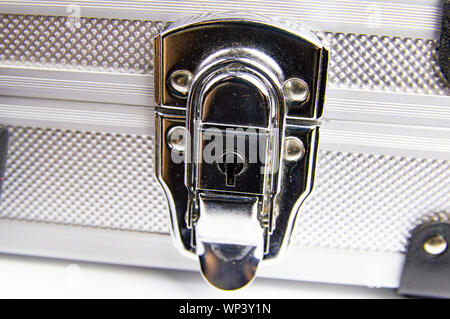 Aluminum case for a working tool on a white background, free space for dext Stock Photo
