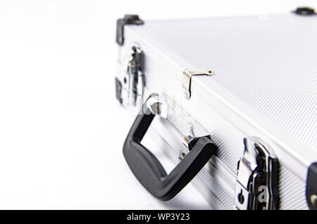 Aluminum case for a working tool on a white background, free space for dext Stock Photo