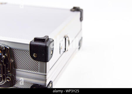 Aluminum case for a working tool on a white background, free space for dext Stock Photo
