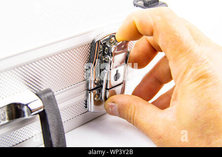 Aluminum case for a working tool on a white background, free space for dext Stock Photo