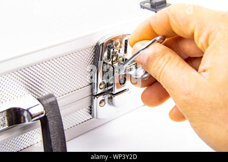 Aluminum case for a working tool on a white background, free space for dext Stock Photo
