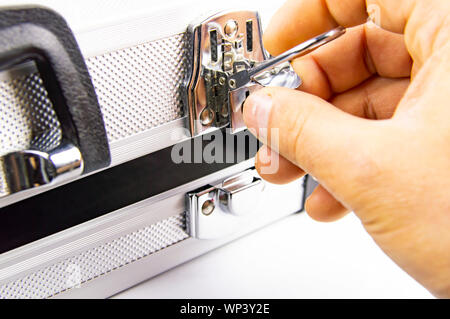 Aluminum case for a working tool on a white background, free space for dext Stock Photo