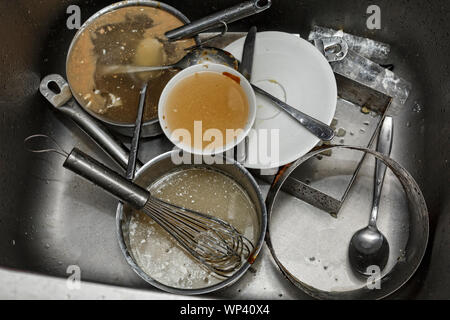 messy pile, big, restaurant, stack, before and after, kitchen, counter, sink, washing lot Stock Photo