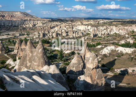 The incredible landscape of  Love Valley at Goreme in Turkey which includes natural rock formations called fairy chimneys. Stock Photo