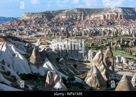 The incredible landscape of  Love Valley at Goreme in Turkey which includes natural rock formations called fairy chimneys. Stock Photo