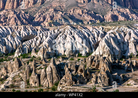 The incredible landscape of  Love Valley at Goreme in Turkey which includes natural rock formations called fairy chimneys. Stock Photo