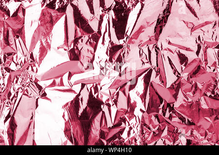 Light pink shiny metallic crumpled texture effect, red wrinkled soft silky background, festive fashion purple glossy art backdrop, abstract design Stock Photo