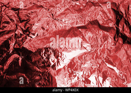 Premium Photo  Closeup of crumpled silver aluminum foil texture in red  tone abstract background use for design