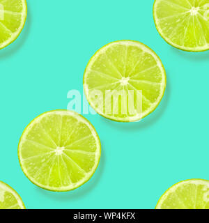 A seamless limes pattern on a vibrant teal blue background, a fruity citrus repeat print Stock Photo