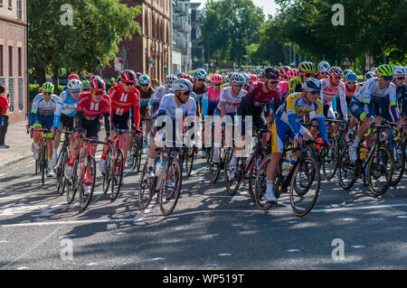 Glasgow, Scotland, UK. 7th September, 2019. The peloton travelling along Greendyke Street at the start of stage one of the OVO Energy Cycling Tour of Britain which is Britain’s biggest professional cycle race and the longest stage of this year’s race covering 125 miles from Glasgow to Kirkcudbright. Credit: Skully/Alamy Live News Stock Photo