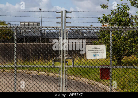 Main gates locked at a sewage plant by a chain linked fence at Burnham on Sea Somerset, UK Stock Photo