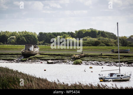 Shipwreck and Boat at Burnham on Sea Marina, Somerset UK Stock Photo