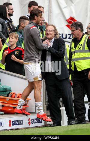 Milton Keynes, UK. 07th Sep, 2019. MK Dons Owner Pete Winkelman congratulates Alex Gilbey of MK Dons after the match during the EFL Sky Bet League 1 match between Milton Keynes Dons and AFC Wimbledon at stadium:mk, Milton Keynes, England on 7 September 2019. Photo by Ken Sparks. Editorial use only, license required for commercial use. No use in betting, games or a single club/league/player publications. Credit: UK Sports Pics Ltd/Alamy Live News Stock Photo